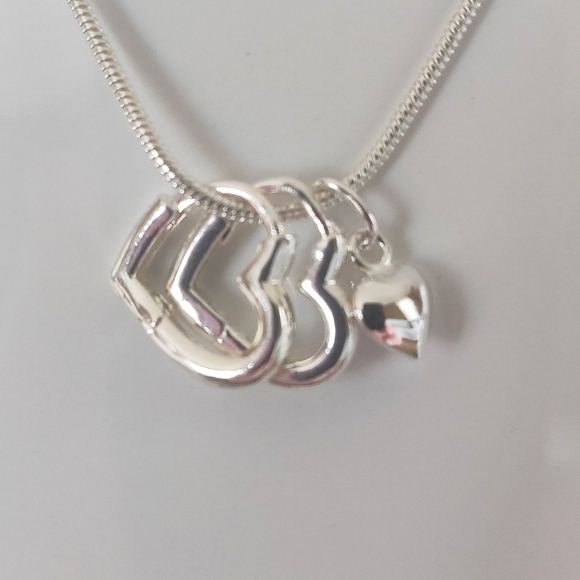 unknown Jewelry - New sterling silver puffed heart charm necklace.